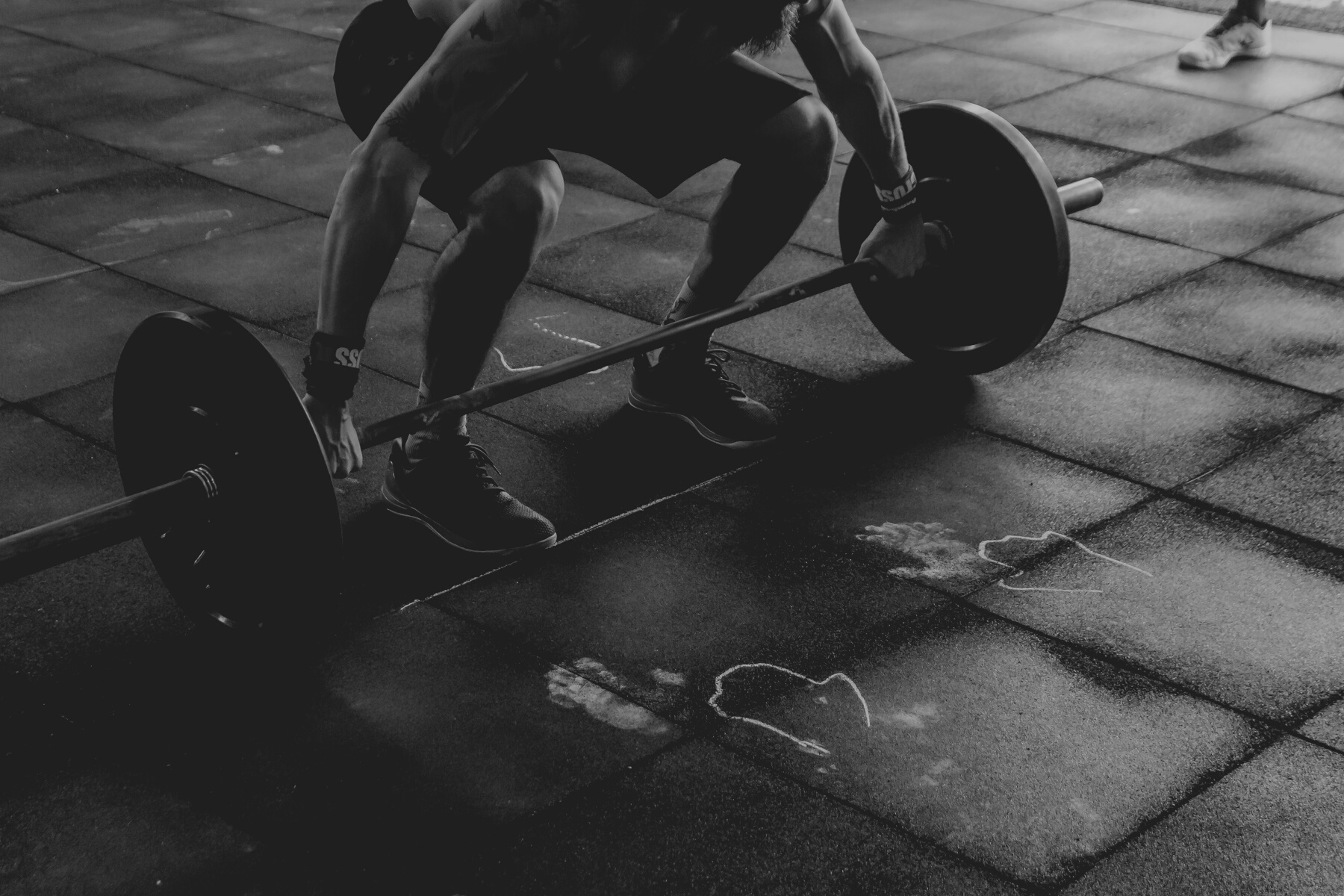 Man About to Lift Barbell